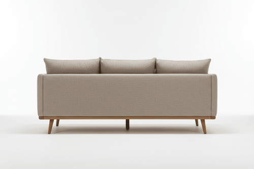 The back view of a neutral-colored ottoman sofa with wooden legs.