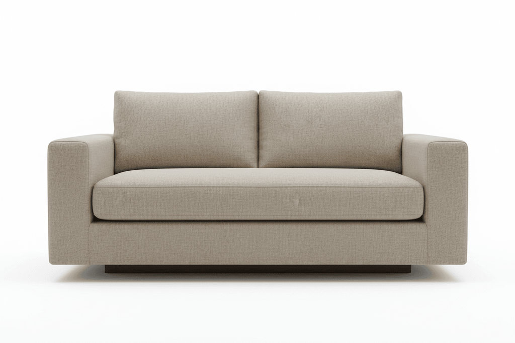 Front view of the comfortable beige ottoman sofa with two plush back cushions