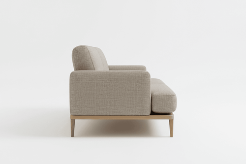 Side profile view of the modern beige ottoman sofa showing wooden legs